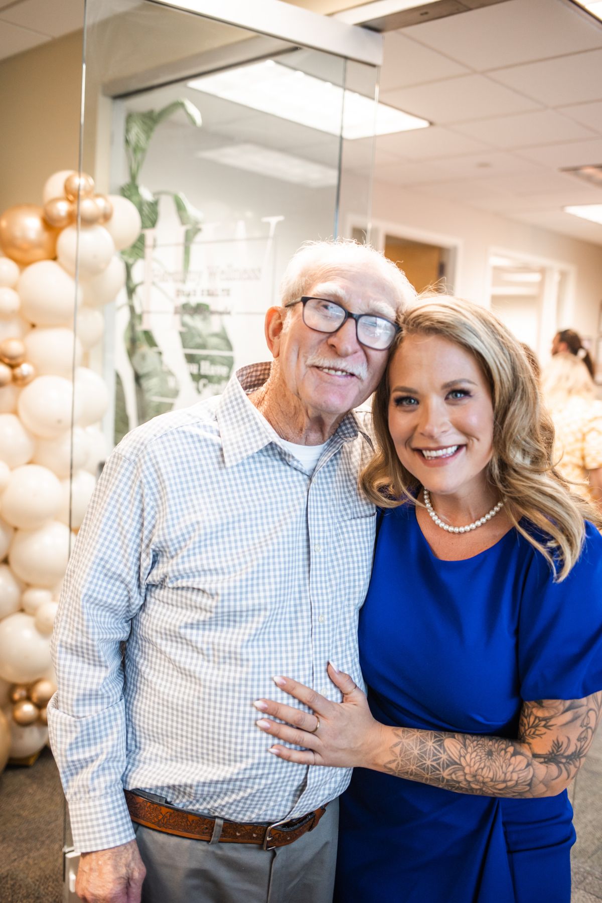 Sarah Foust with community member at Grand Opening